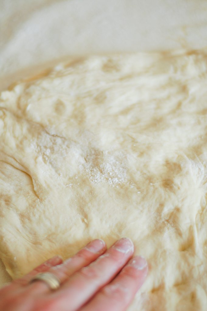 hand shaping homemade bread dough