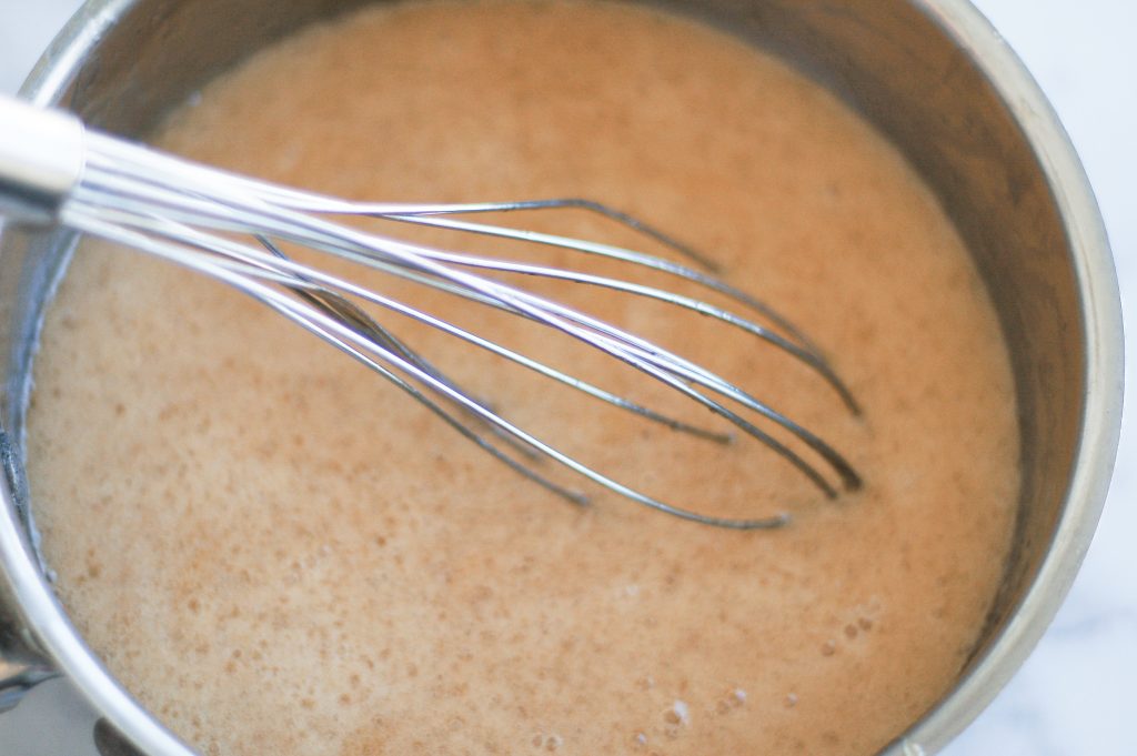 bubbling honey and coconut mixture for homemade granola